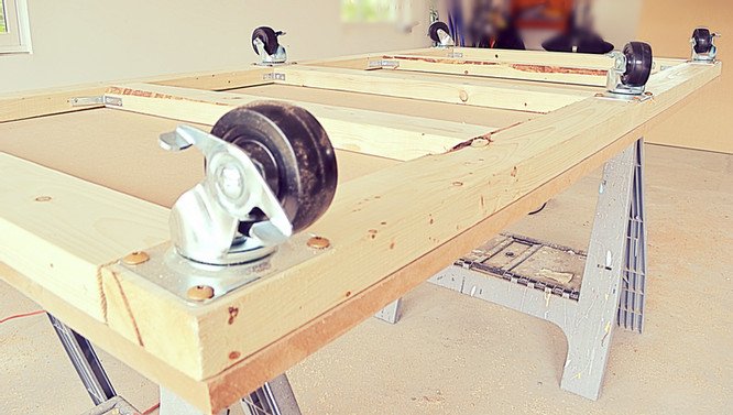 Bottom of workbench adding casters to the base.
