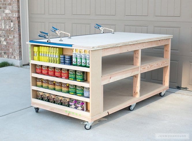 DIY Mobile workbench by Maker with paint cans in driveway.