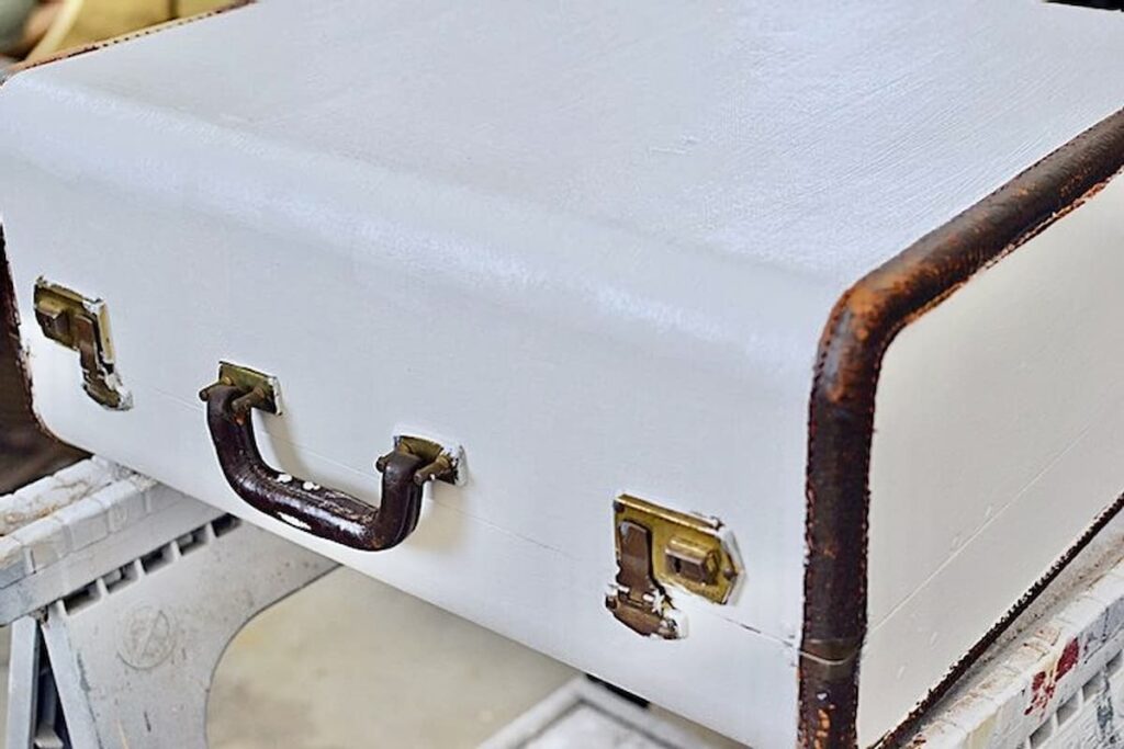 Painted white old suitcase