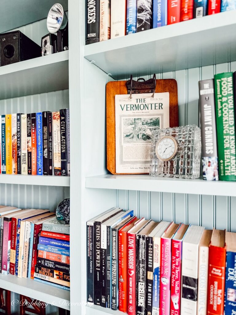 A vintage clipboard with The Vermonter vintage magazine sits on a bookshelf