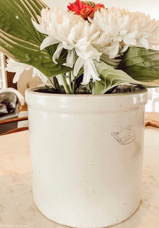 Antique Crockery Unique Flower Display with carnations and hostas.