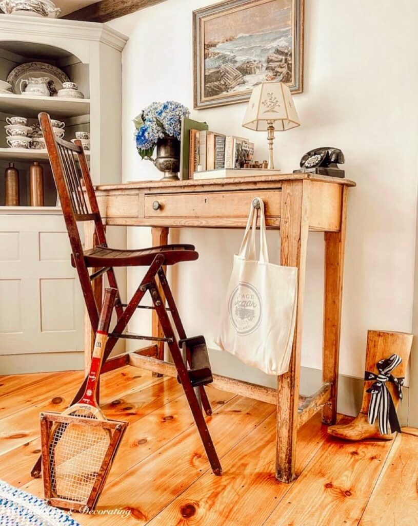 Antique tennis umpire chair with desk and vintage tennis racket decor for summer.
