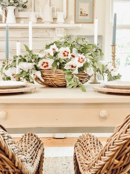 Basket of Rose of Sharon on white farmhouse table.