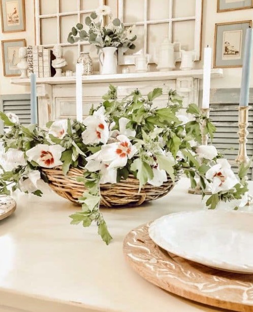 Basket of Rose of Sharon on white farmhouse table.