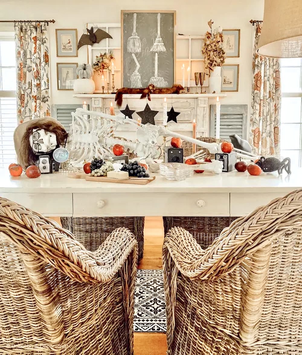 Halloween table decor with skeleton centerpiece dressed up for a party.