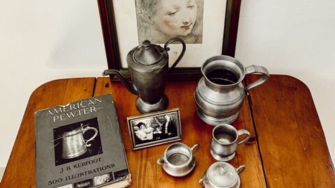 decorating with vintage collections using antique pewter books and heirloom decor