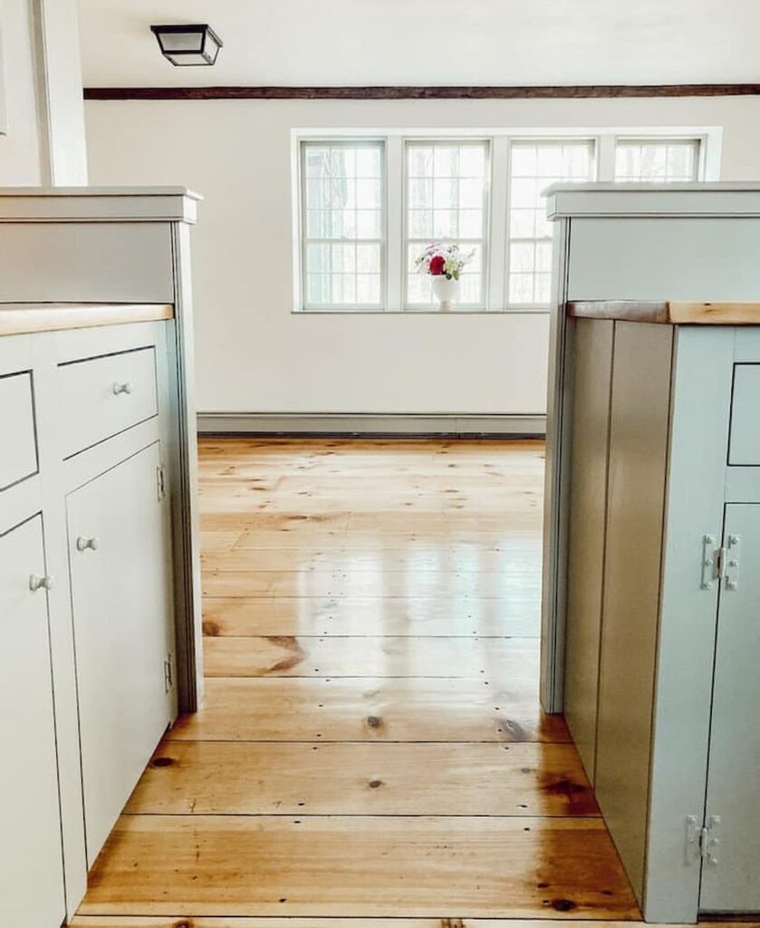 Vintage home restoration in kitchen with newly sanded and refinished wood countertops with Nantucket Gray cupboards and Simply white walls and refinished flooring.
