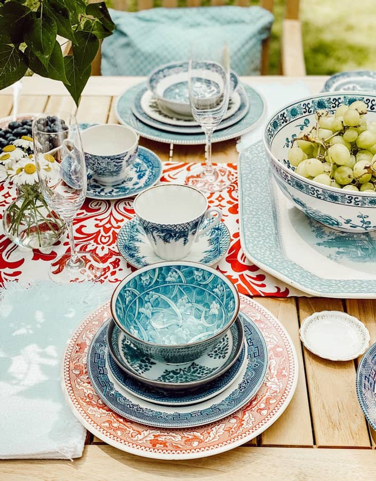 Vintage place settings on alfresco patriotic tablescape.