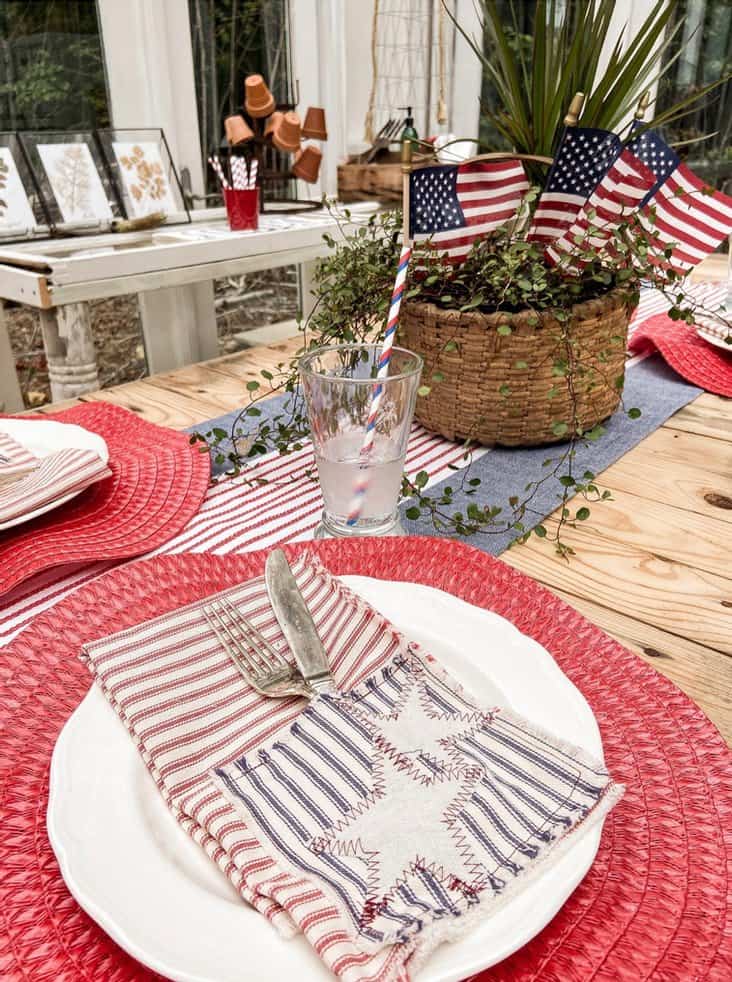Easy DIY star spangle napkin and silverware holders on outdoor greenhouse tablescape.