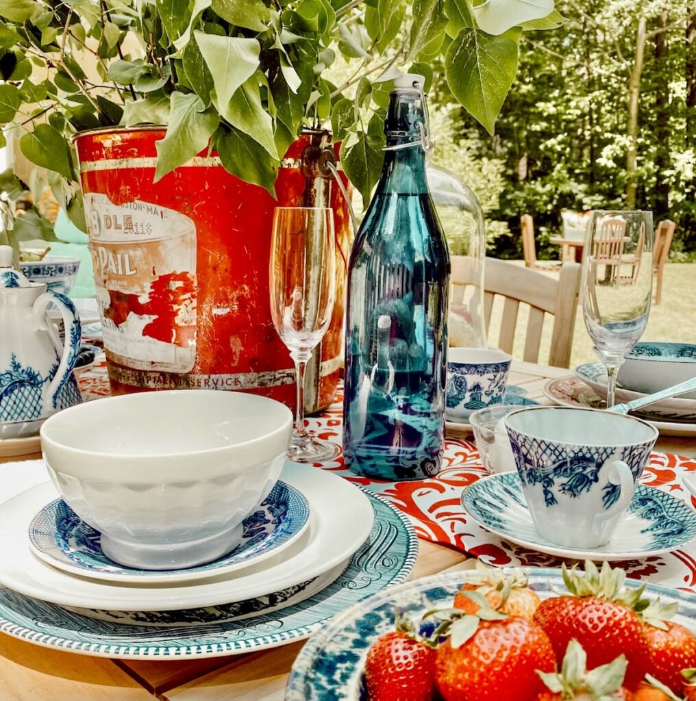 Red, white, and blue Patriotic alfresco table setting set for breakfast.