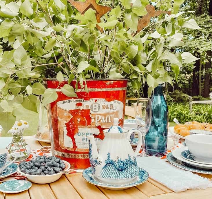 Patriotic vintage inspired red, white, and blue alfresco tablescape.