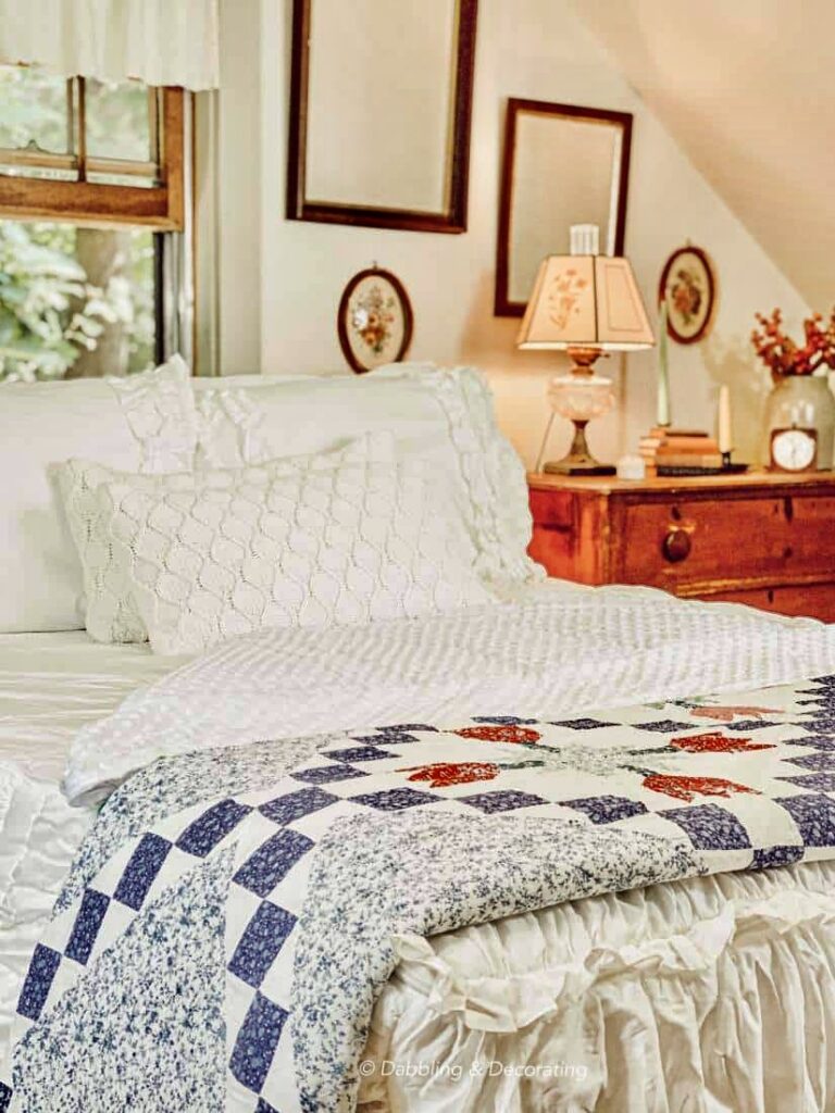 Quaint small vintage styled bedroom with Beddy's Zipper Bedding in white with quilt.