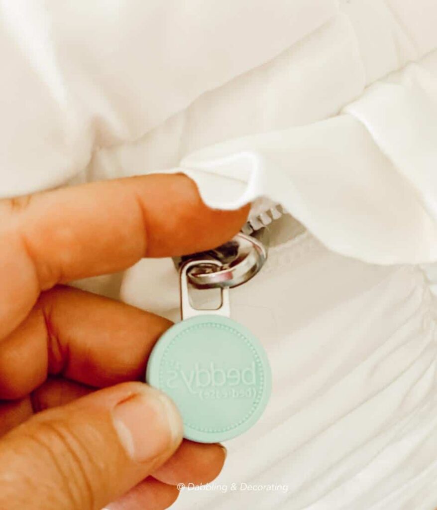 Beddy's iconic blue zipper on their white zipper bed.