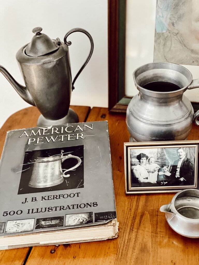Antique Pewter with American Pewter Book on Table