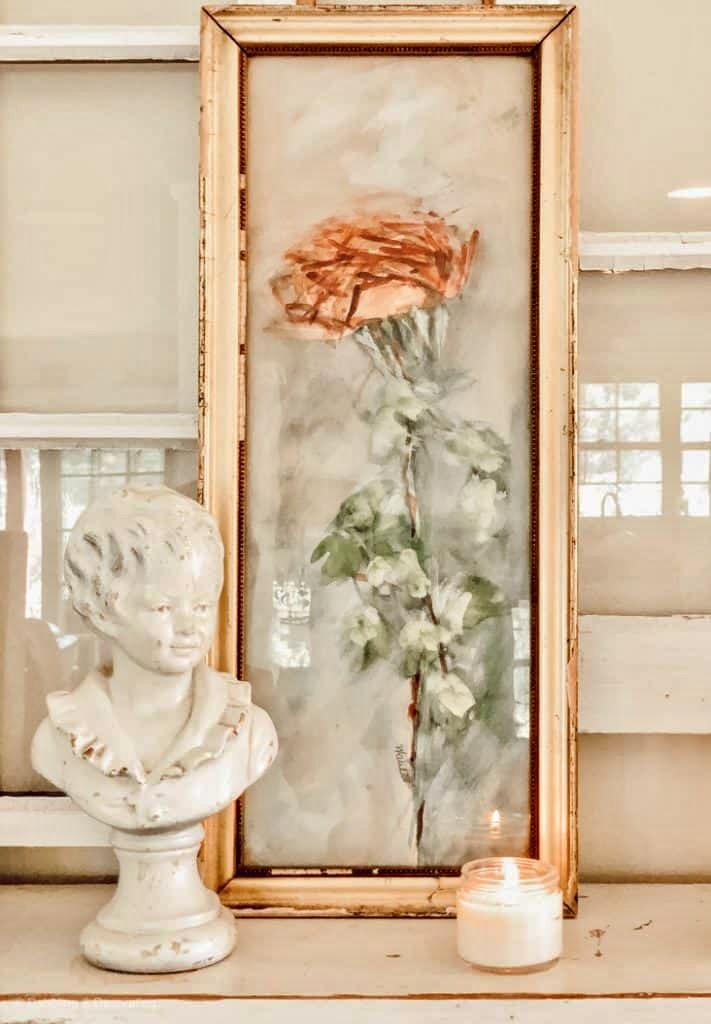 Gold Frame with vintage bust layered with salvaged windows on mantel