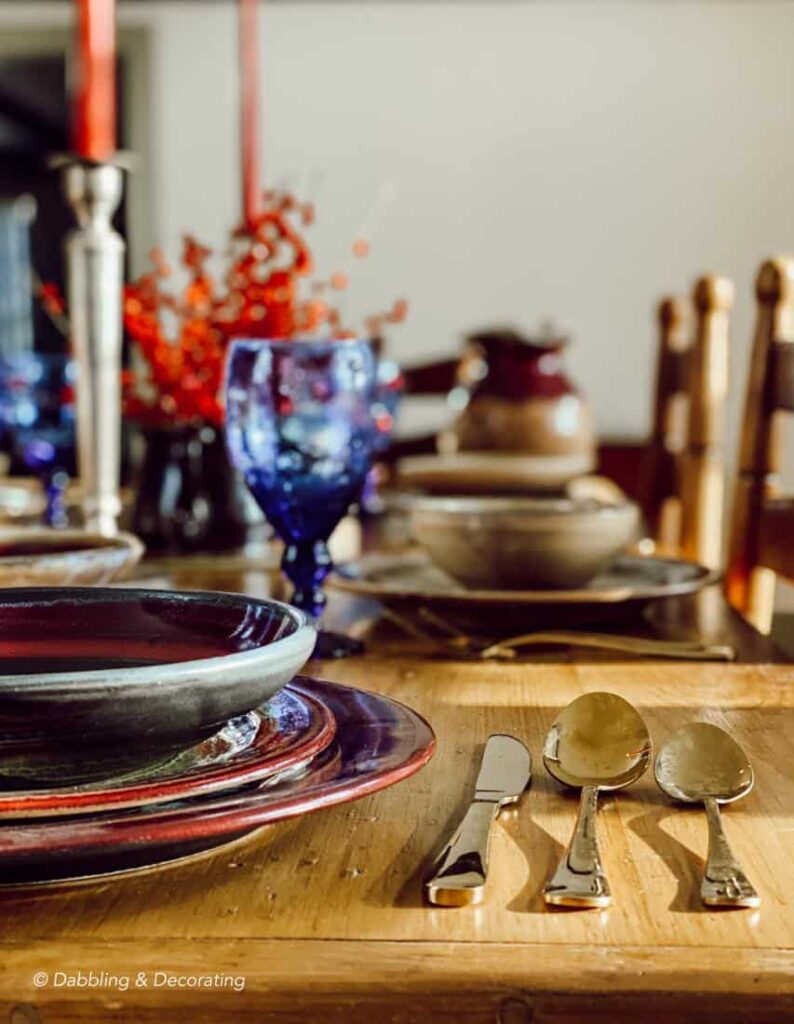 Table place setting with moody colors.