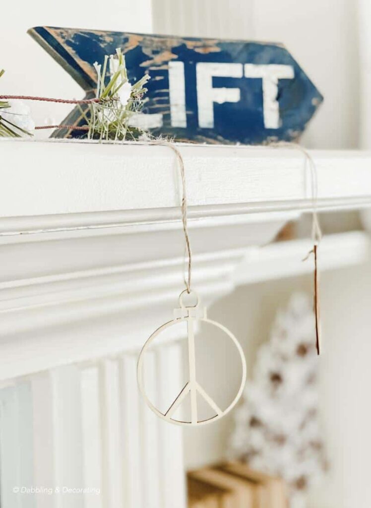 Ski Lift Sign on Mantel with Peace Garland