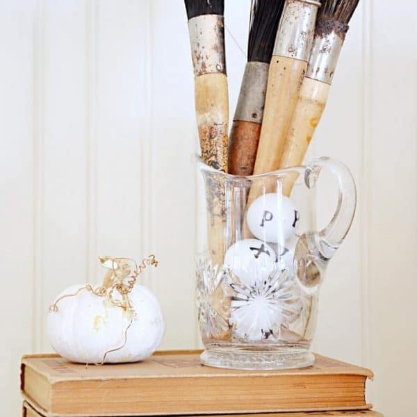 paintbrushes, pumpkin, and books