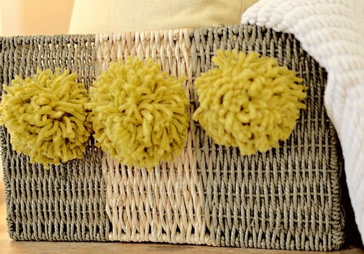 Striped basket with pom poms