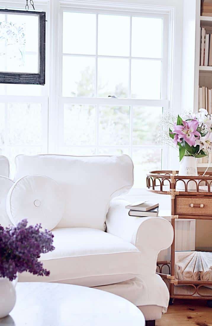 Sunroom makeover w/ white loveseat and vintage wicker beverage cart.