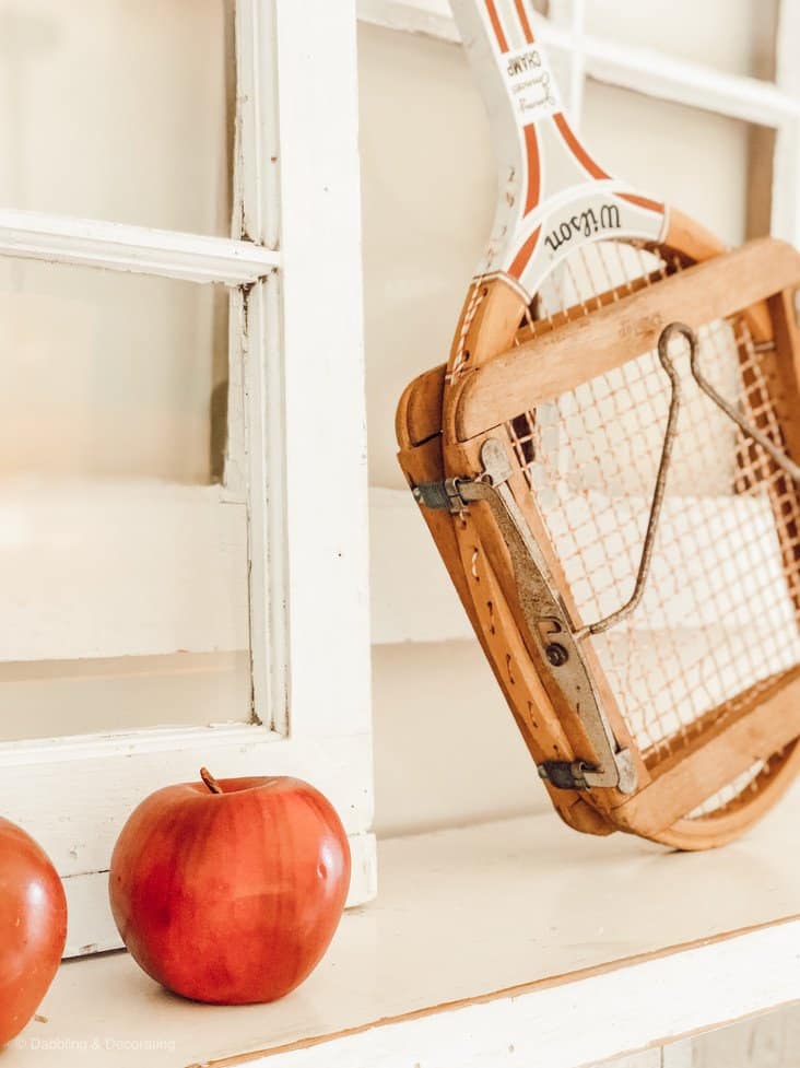 Vintage Tennis racquet and apple