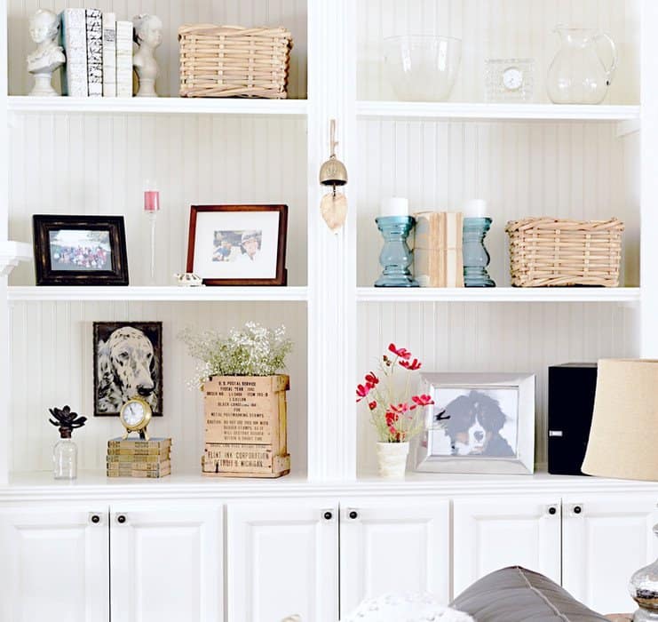 Built-Ins with vintage books, baskets, candles and more.