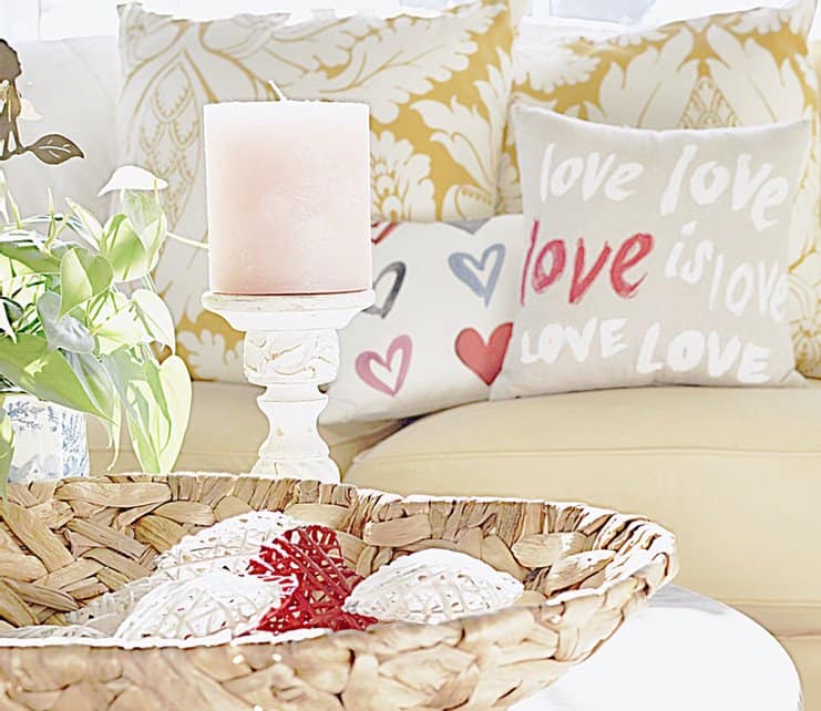 Valentine's Day decor with pillows, candles and heart basket. Valentine's Day decor with pillows, candles and heart basket.