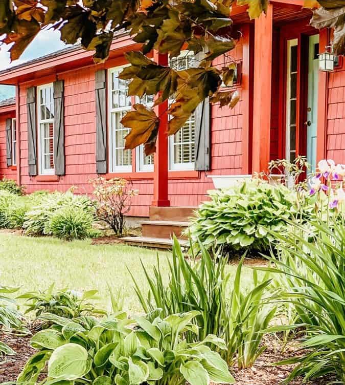 Nordic Blue Front Door on a Rustic Red House