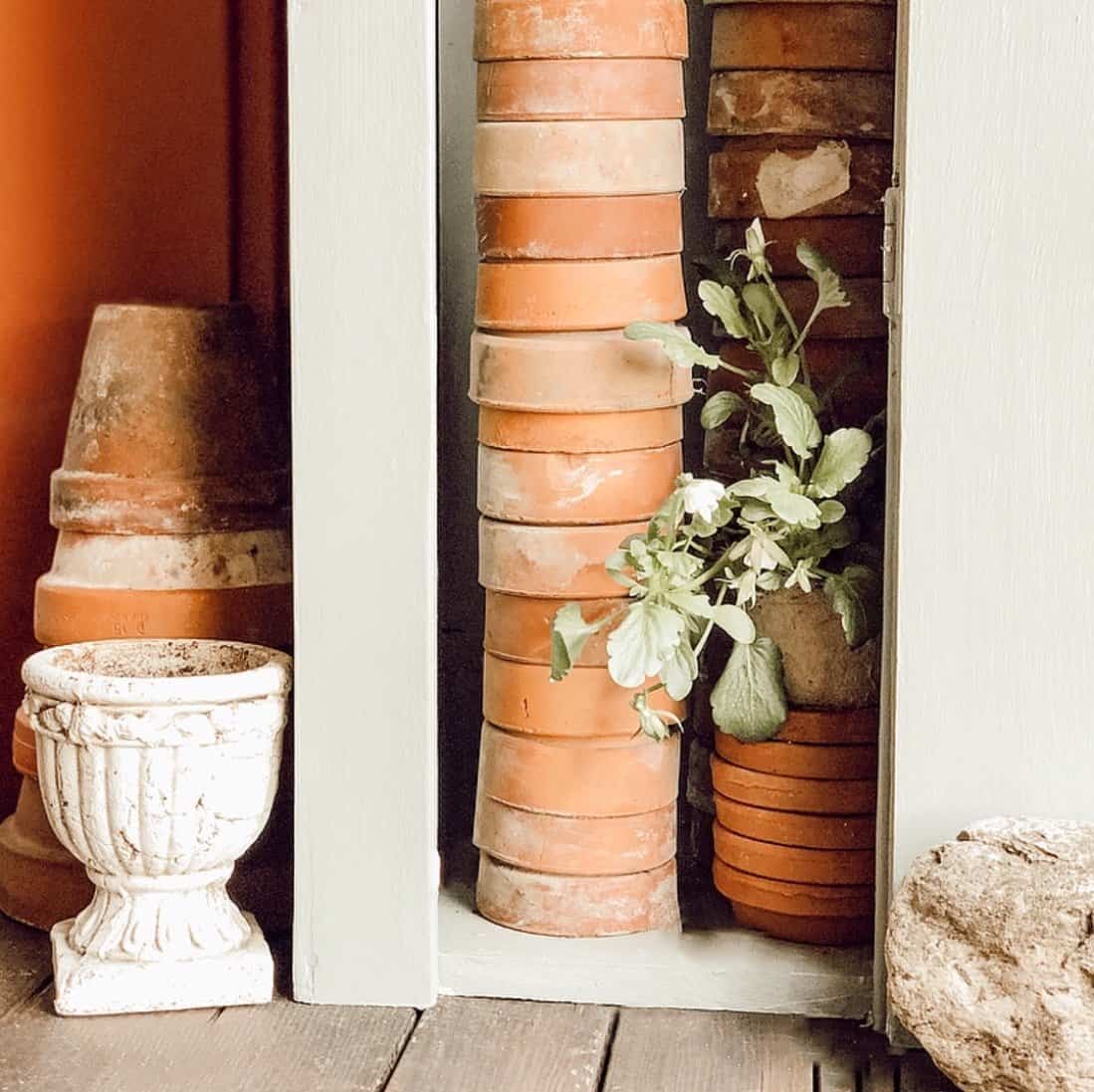 A Garden Cupboard with Terracotta Pots