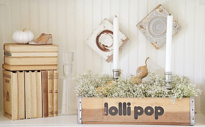 Vintage lolli pop crate and vintage book collection.