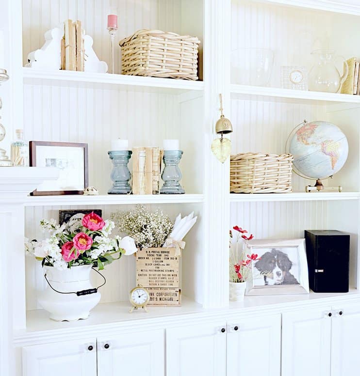 Decorated shelfie builtins with vintage finds.