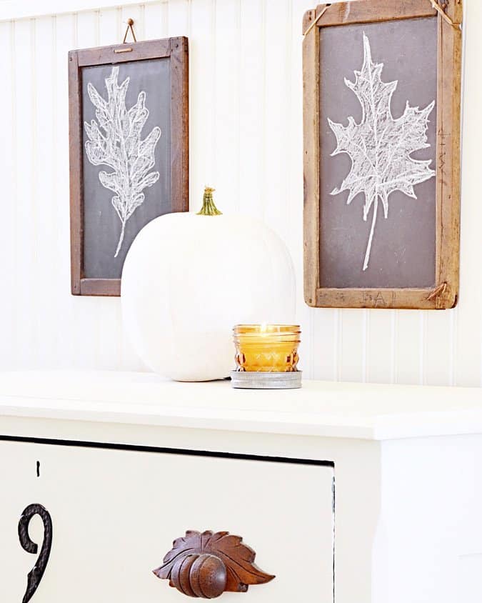 Antique children's chalkboards with fall decor.