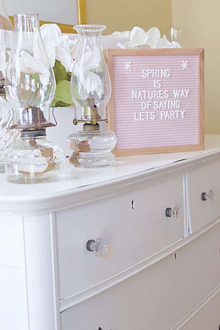 Vintage bureau with Pink Felt Letter board and vintage oil lanterns. Vintage bureau with Pink Felt Letter board and vintage oil lanterns.