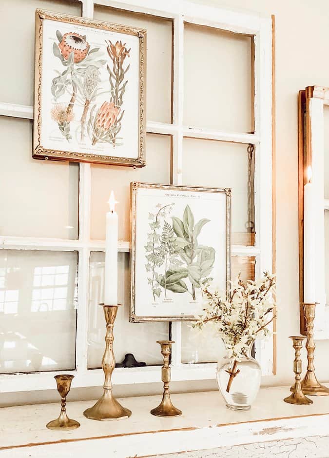 Salvaged windows with spring botanicals over vintage fireplace mantel.