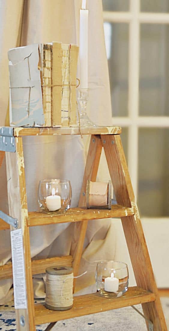 Step ladder with vintage books, candle and more.