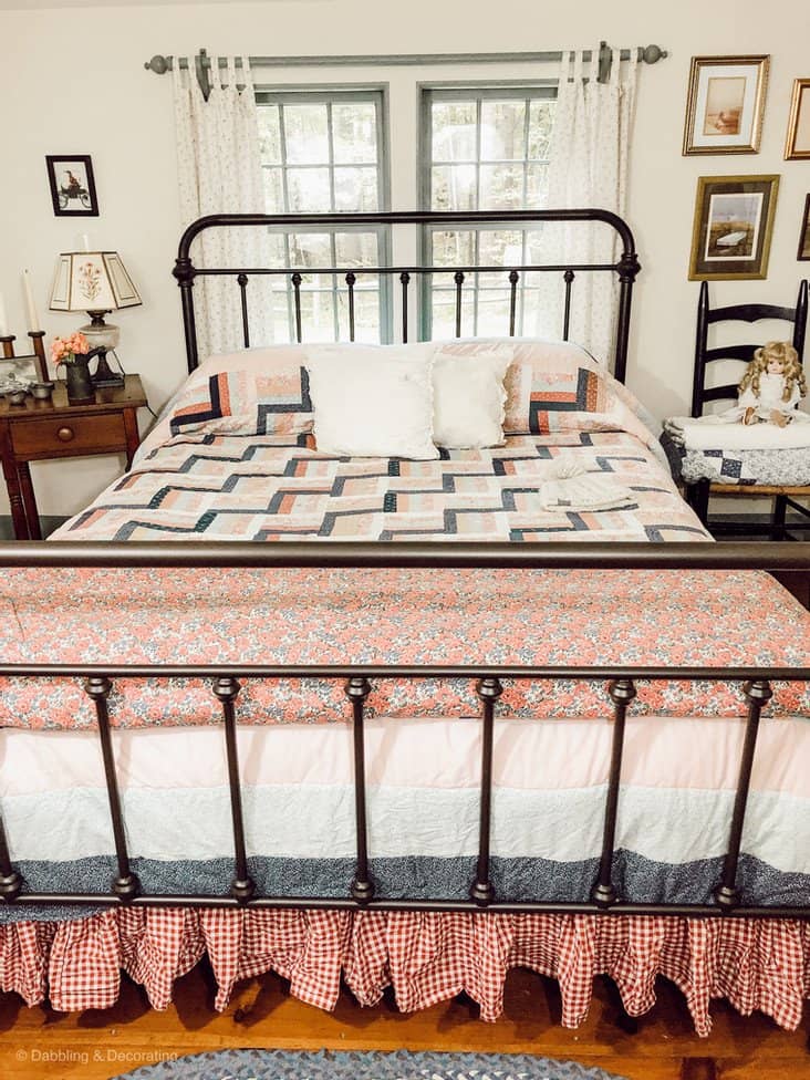 Wrought Iron bed with quilt.