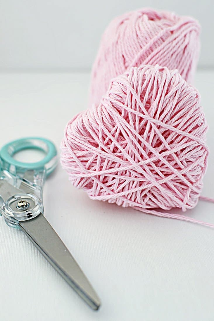 Wrapped heart in pink yarn.