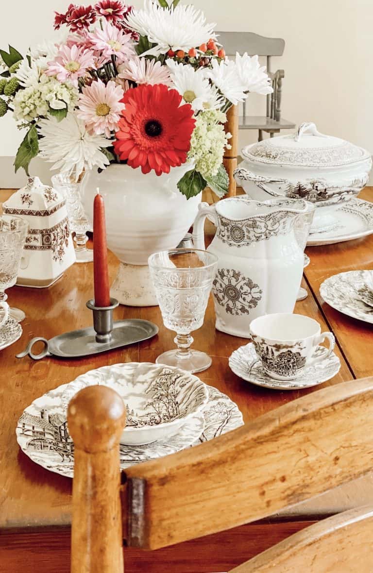 A vase of flowers sitting on top of a wooden table