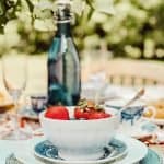 A close up of a bowl of strawberries on a table
