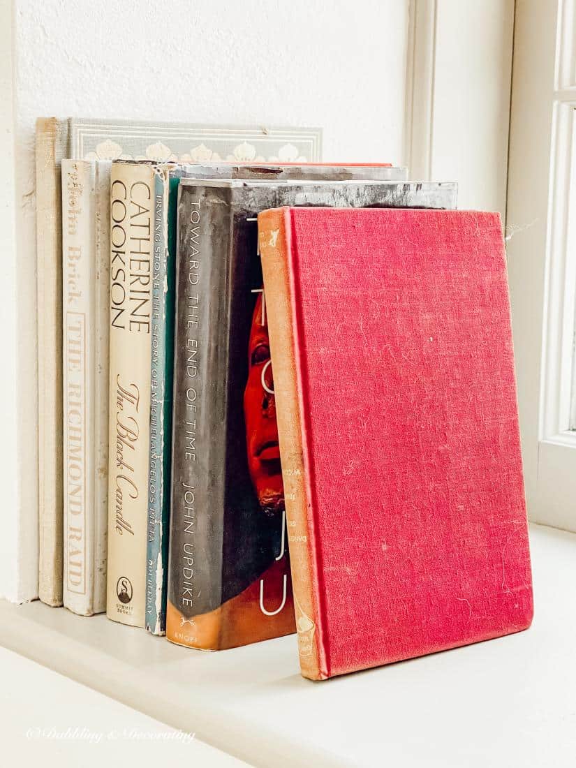 vintage books on the windowsill