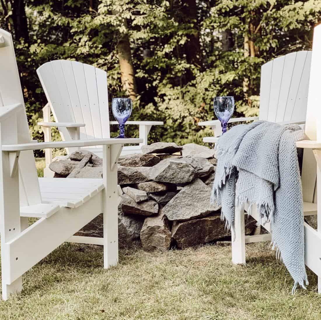 Adirondack chairs around a fire pit