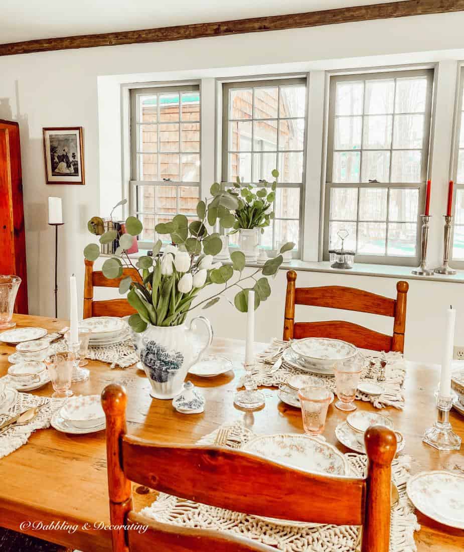 Timeless vintage spring table setting in dining room.