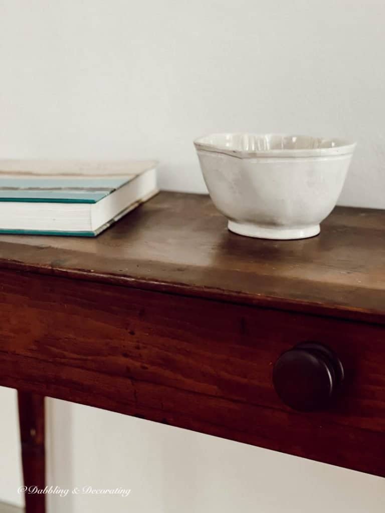 A pot that is sitting on a wooden table