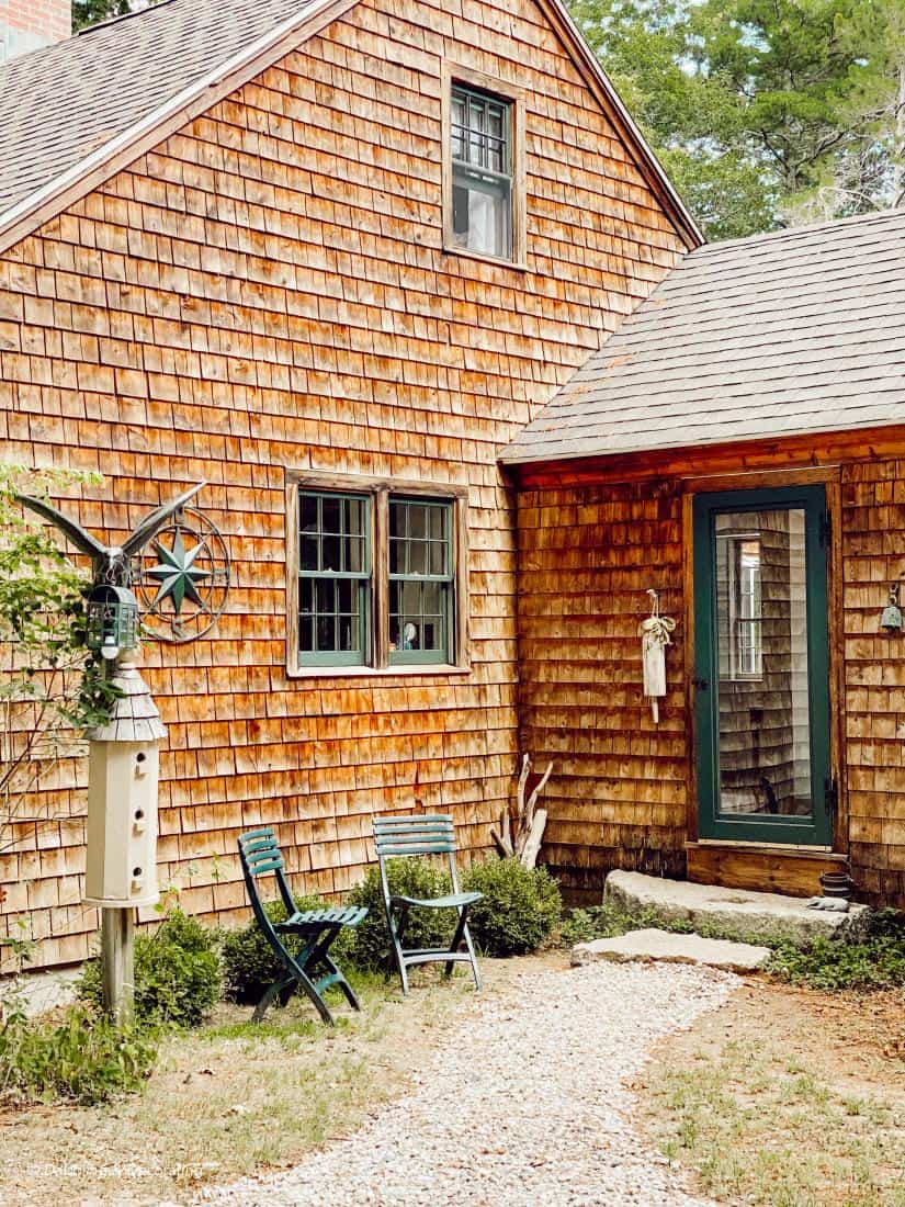 Restored cedar shake siding home entryway.