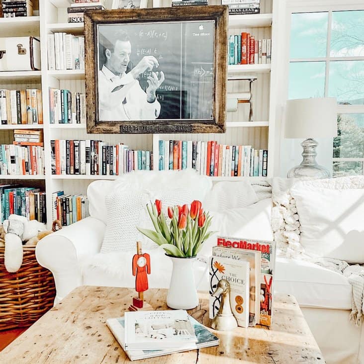Small Home Library with white sectional pine coffee table decor and books on bookshelves.