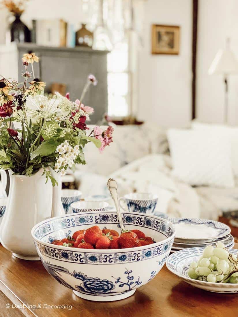 Vintage china and fruit on fireside table.