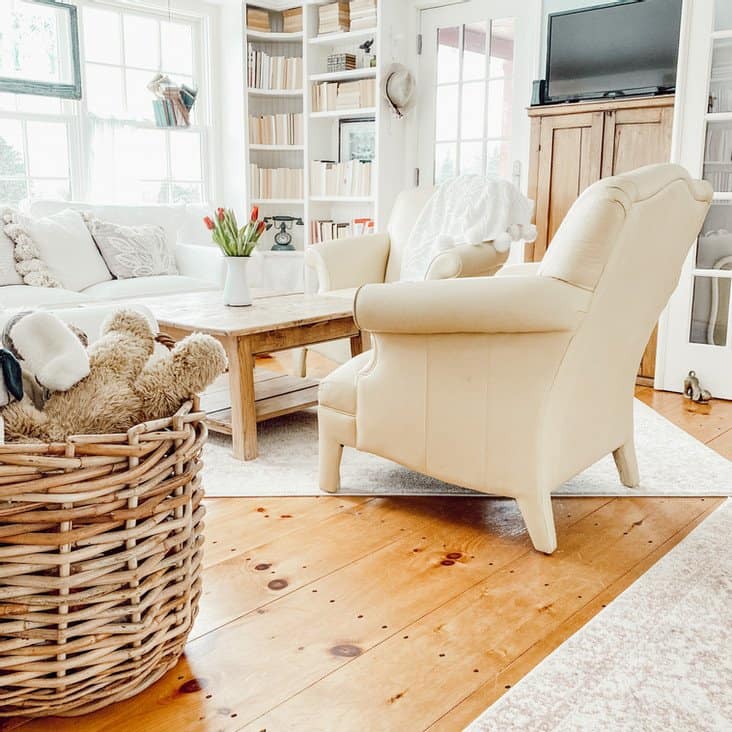 Small Home Library with yellow leather seating, pine coffee table and bookshelves.