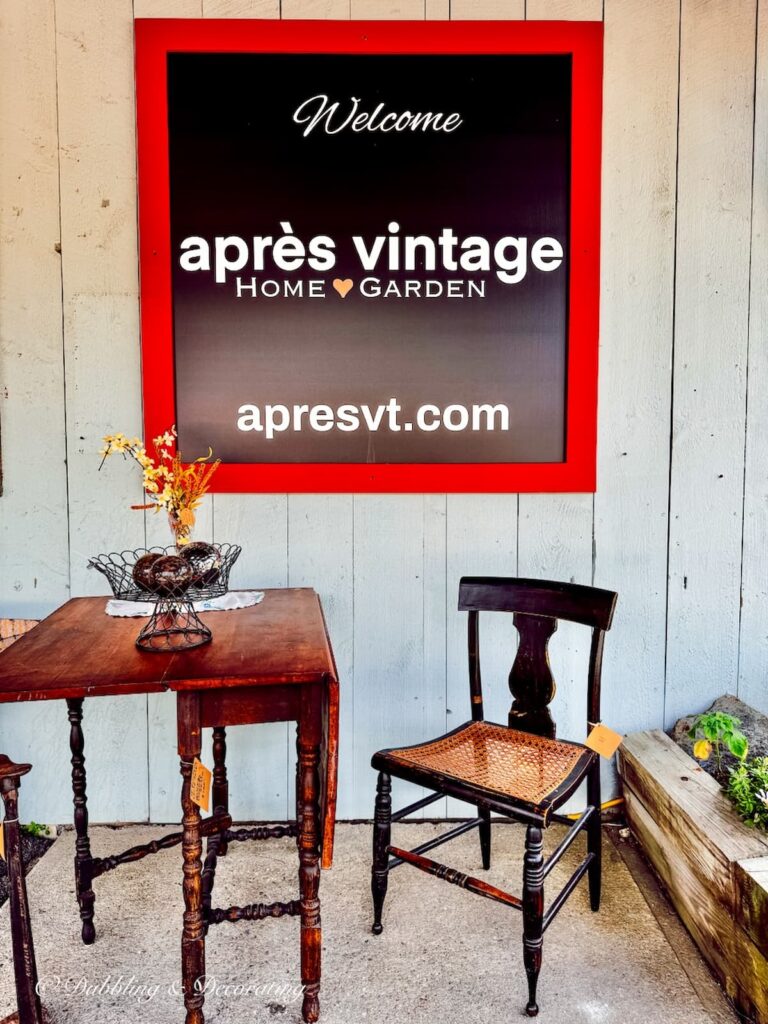 Apres Vintage Shop sign with vintage table and chairs in Wilmington, Vermont. New England Vintage and Thrift Shopping Guide