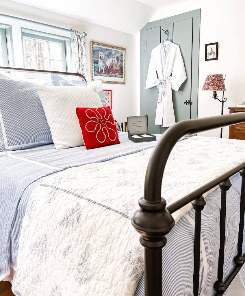 Blue and white seersucker bedding in coastal vintage styled bedroom.