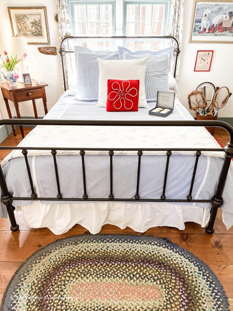 Coastal styled guest bedroom with seersucker bedding.